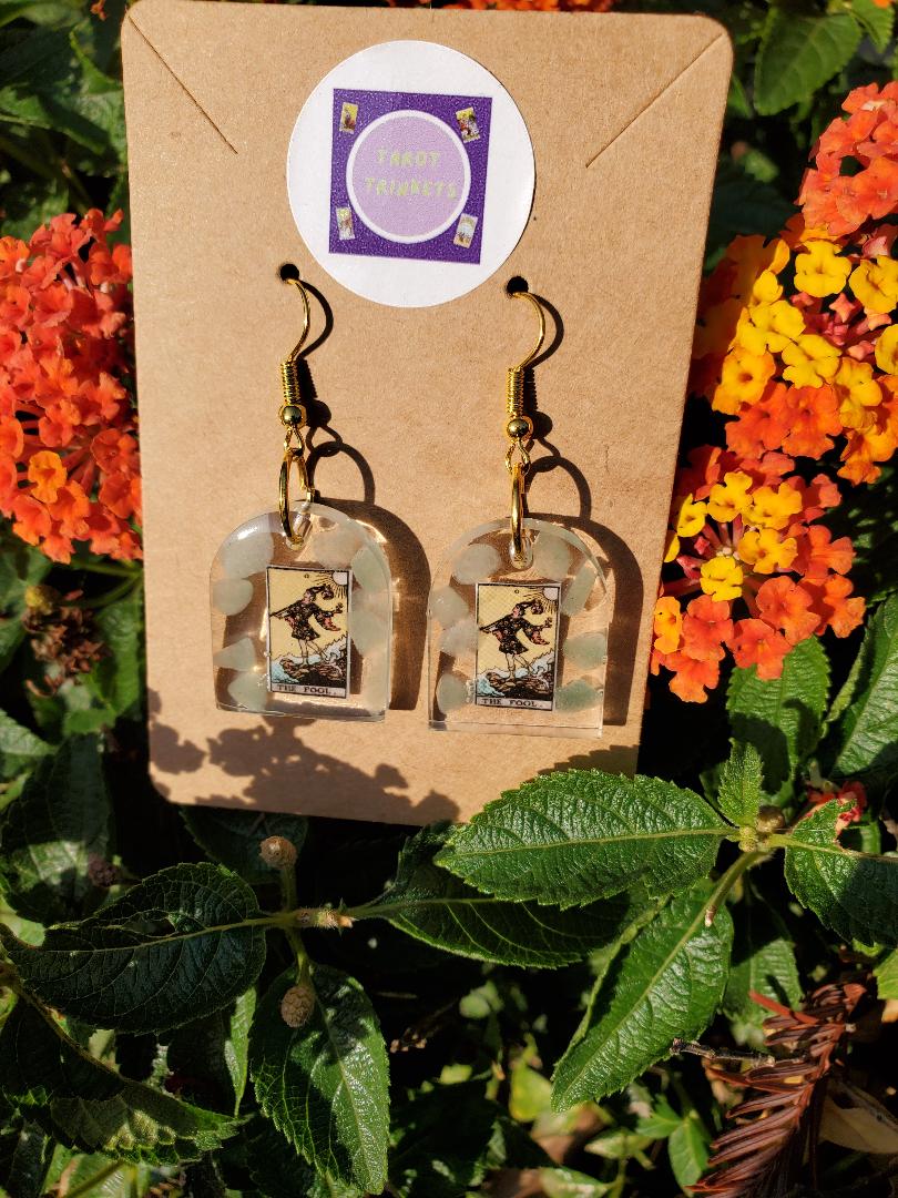 Earrings: FOOL TAROT CARD-OR THE DREAMER. RESIN WINDOW SHAPED EARRING W/GREEN AVENTURINE, GOLD HARDWARE.