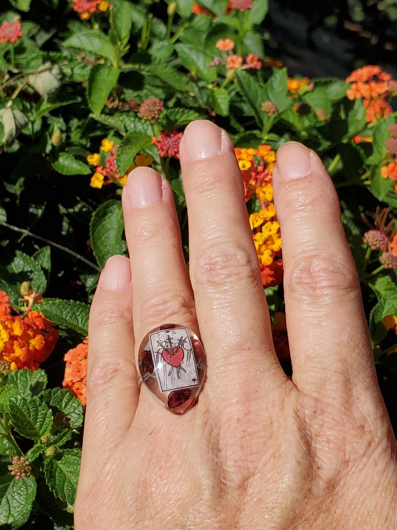 Ring: Large Tear Drop Resin Ring w/The 3 of Swords Tarot Card w/Garnet/Silver Hardware